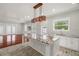 Open concept kitchen with island and hardwood floors at 6016 82Nd N Ter, Pinellas Park, FL 33781