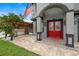 Elegant front entrance with a red door and brick walkway at 6016 82Nd N Ter, Pinellas Park, FL 33781