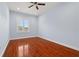 Charming bedroom with hardwood floors and a window with shutters at 6016 82Nd N Ter, Pinellas Park, FL 33781