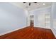 Spacious bedroom with hardwood floors and access to a hallway at 6016 82Nd N Ter, Pinellas Park, FL 33781
