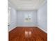 Charming bedroom with hardwood floors and light walls at 6016 82Nd N Ter, Pinellas Park, FL 33781