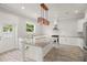 Modern kitchen with granite island and white cabinets at 6016 82Nd N Ter, Pinellas Park, FL 33781