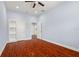 Bright bedroom featuring hardwood floors and ample closet space at 6016 82Nd N Ter, Pinellas Park, FL 33781