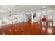 Open concept living room and kitchen with hardwood floors at 6016 82Nd N Ter, Pinellas Park, FL 33781