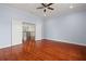 Spacious bedroom with hardwood floors and access to upper hallway at 6016 82Nd N Ter, Pinellas Park, FL 33781