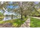 Peaceful lakefront community with scenic walking paths and lush greenery at 3864 Darston St, Palm Harbor, FL 34685