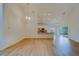 Open living room with high ceilings and hardwood floors, featuring a kitchen with granite countertops at 1950 Lillian Ave, Tarpon Springs, FL 34689