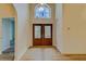 Bright entryway with double doors and arched window at 1950 Lillian Ave, Tarpon Springs, FL 34689