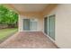 Covered patio overlooking fenced backyard at 1950 Lillian Ave, Tarpon Springs, FL 34689