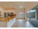 Modern kitchen with granite countertops, stainless steel appliances, and sliding glass doors at 1950 Lillian Ave, Tarpon Springs, FL 34689