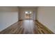 Bright bedroom featuring wood-look tile floors and access to the backyard at 1950 Lillian Ave, Tarpon Springs, FL 34689