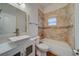 Modern bathroom with tile shower/tub combo and white vanity at 1950 Lillian Ave, Tarpon Springs, FL 34689