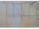 Large walk-in closet with wire shelving and hanging rods at 1950 Lillian Ave, Tarpon Springs, FL 34689