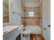 Updated bathroom with tile shower/tub surround and vanity at 1950 Lillian Ave, Tarpon Springs, FL 34689
