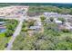 Aerial view of a house on a tree-lined street, near construction at 1950 Lillian Ave, Tarpon Springs, FL 34689