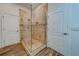 Modern shower with glass enclosure and tile surround at 1950 Lillian Ave, Tarpon Springs, FL 34689
