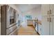 Modern kitchen with stainless steel appliances and granite countertops at 1950 Lillian Ave, Tarpon Springs, FL 34689