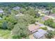 Aerial view of a house situated among other homes in a quiet neighborhood at 1950 Lillian Ave, Tarpon Springs, FL 34689