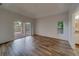 Spacious bedroom with sliding glass doors and wood-look tile floors at 1950 Lillian Ave, Tarpon Springs, FL 34689