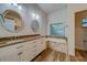 Elegant bathroom with double vanity, granite countertop, and soaking tub at 1950 Lillian Ave, Tarpon Springs, FL 34689