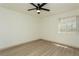 Bright bedroom with vinyl flooring and ceiling fan at 6931 Stones Throw N Cir # 5106, St Petersburg, FL 33710