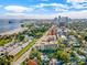 Aerial view of a condo building near the bay with a cityscape background and parking lot at 1200 N Shore Ne Dr # 301, St Petersburg, FL 33701