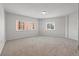 Bright, carpeted bedroom with two windows and neutral paint offers a serene and spacious atmosphere at 1200 N Shore Ne Dr # 301, St Petersburg, FL 33701