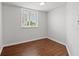 Empty room with hardwood floors, a window and an electrical panel at 1200 N Shore Ne Dr # 301, St Petersburg, FL 33701