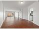 Spacious and bright living room features hardwood floors, sliding glass doors, and a modern kitchen view at 1200 N Shore Ne Dr # 301, St Petersburg, FL 33701