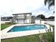 Inviting backyard pool with a spacious patio area next to the house at 22607 Southshore Dr, Land O Lakes, FL 34639