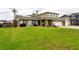 Two-story house with a large green lawn at 22607 Southshore Dr, Land O Lakes, FL 34639