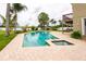 Large, inviting pool with a spa and expansive patio at 22607 Southshore Dr, Land O Lakes, FL 34639