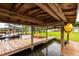 Covered boat dock with kayak storage and lake views at 22607 Southshore Dr, Land O Lakes, FL 34639