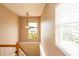 Upstairs landing with a view of the lake from a window at 22607 Southshore Dr, Land O Lakes, FL 34639