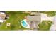 Top-down view of a house with a pool, solar panels, and a large backyard at 22607 Southshore Dr, Land O Lakes, FL 34639