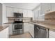 Updated kitchen featuring stainless steel appliances and ample cabinetry at 1200 N Shore Ne Dr # 301, St Petersburg, FL 33701