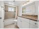 Clean bathroom, granite countertop, and updated vanity at 1200 N Shore Ne Dr # 301, St Petersburg, FL 33701
