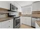 Bright kitchen boasts stainless steel appliances and granite countertops at 1200 N Shore Ne Dr # 301, St Petersburg, FL 33701