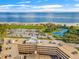 Aerial view of building, parking and tennis courts nearby at 1200 N Shore Ne Dr # 301, St Petersburg, FL 33701