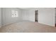 Spacious bedroom with neutral carpeting and a walk-in closet at 1200 N Shore Ne Dr # 301, St Petersburg, FL 33701