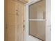 Light beige front door with storm door at 1200 N Shore Ne Dr # 301, St Petersburg, FL 33701