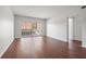 Living room with wood-look floors and access to balcony at 1200 N Shore Ne Dr # 301, St Petersburg, FL 33701