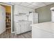 Galley kitchen with white cabinets and appliances at 1200 N Shore Ne Dr # 301, St Petersburg, FL 33701