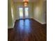 Dining room with hardwood floors and French doors at 119 Stafford Dr, Palm Harbor, FL 34684