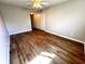 Bedroom with hardwood floors, closet and ceiling fan at 2263 Americus E Blvd # 53, Clearwater, FL 33763