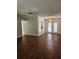 Bright living room featuring hardwood floors and a ceiling fan at 119 Stafford Dr, Palm Harbor, FL 34684