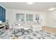 Spacious living area featuring a comfortable sectional sofa and large windows at 10617 N 27Th St, Tampa, FL 33612