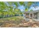 Spacious backyard with screened porch and lush greenery at 10617 N 27Th St, Tampa, FL 33612