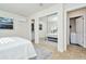 Bedroom with mirrored closet doors and access to en-suite bathroom at 10617 N 27Th St, Tampa, FL 33612