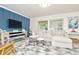 Bright living room with sectional sofa, fireplace, and stylish decor at 10617 N 27Th St, Tampa, FL 33612